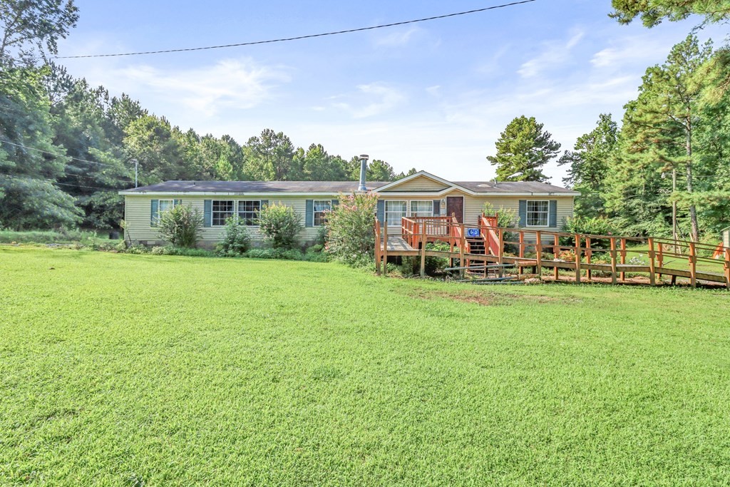 2676 South Riverbend Road Dalton, GA 30721 - Photo 3 of 28 a view of a house with a backyard porch and sitting area