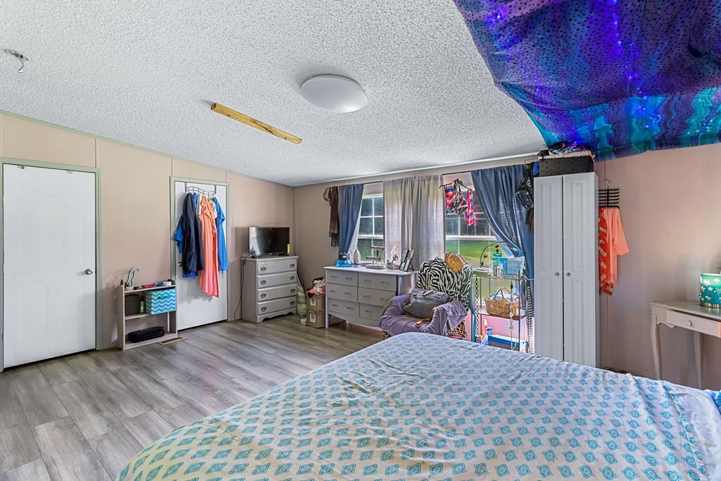 2676 South Riverbend Road Dalton, GA 30721 - Photo 4 of 28 a bed room with a bed and a desk