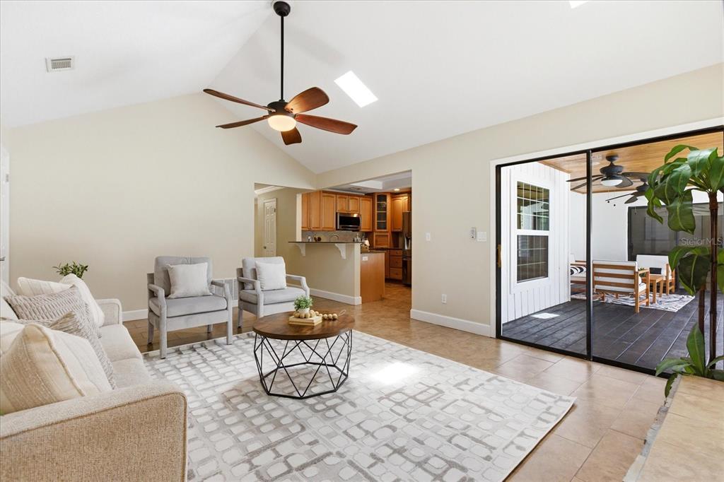 393 Wekiva Cove Road Longwood, FL 32779 - Photo 15 of 49 a living room with furniture and a flat screen tv