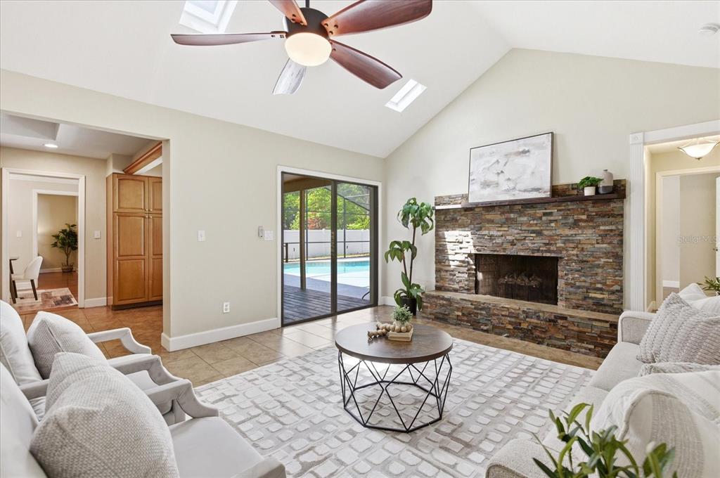 393 Wekiva Cove Road Longwood, FL 32779 - Photo 16 of 49 a living room with furniture and a fireplace