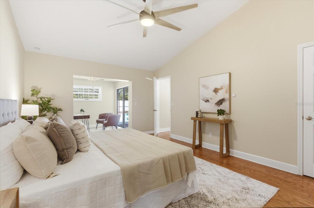 393 Wekiva Cove Road Longwood, FL 32779 - Photo 18 of 49 a bedroom with a bed and wooden floor