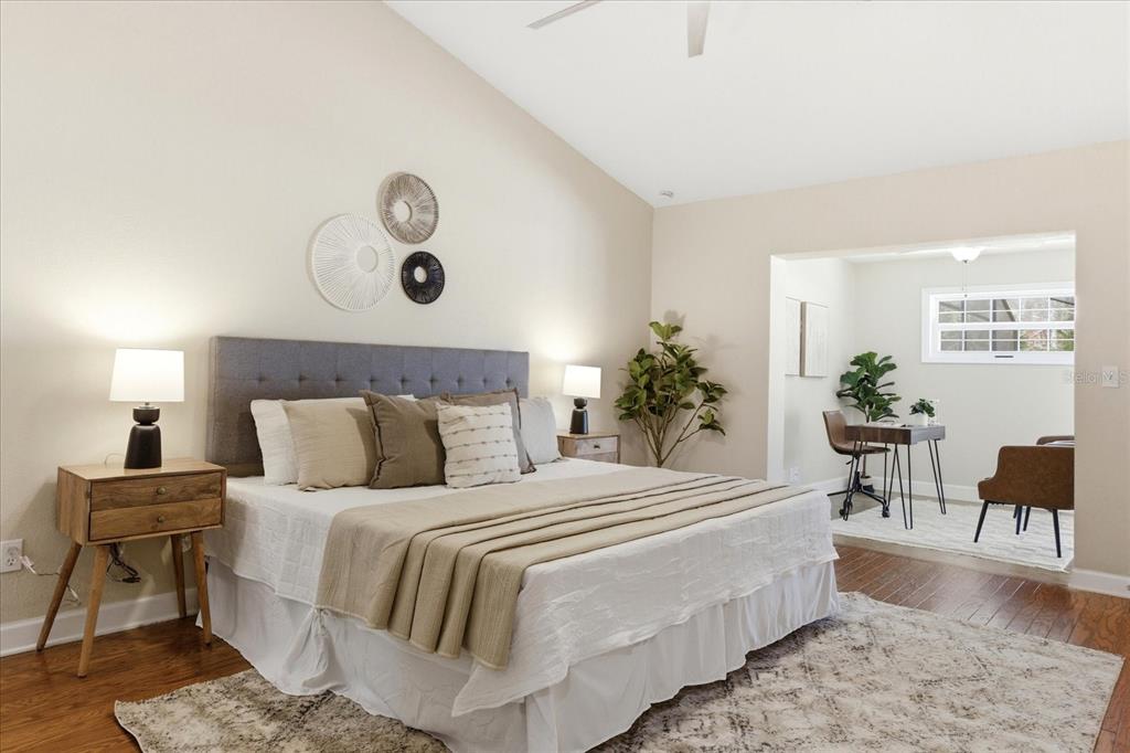 393 Wekiva Cove Road Longwood, FL 32779 - Photo 19 of 49 a bedroom with a bed and a chair