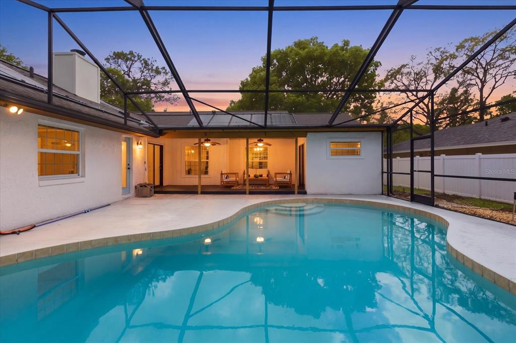 393 Wekiva Cove Road Longwood, FL 32779 - Photo 2 of 49 a view of a swimming pool with a patio