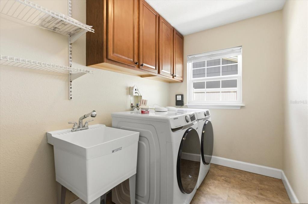 393 Wekiva Cove Road Longwood, FL 32779 - Photo 24 of 49 a utility room with dryer and washer