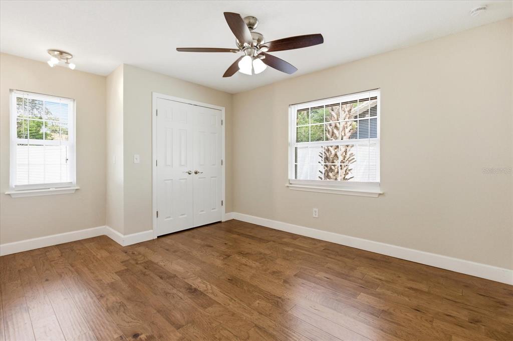 393 Wekiva Cove Road Longwood, FL 32779 - Photo 27 of 49 a view of an empty room with wooden floor and a window