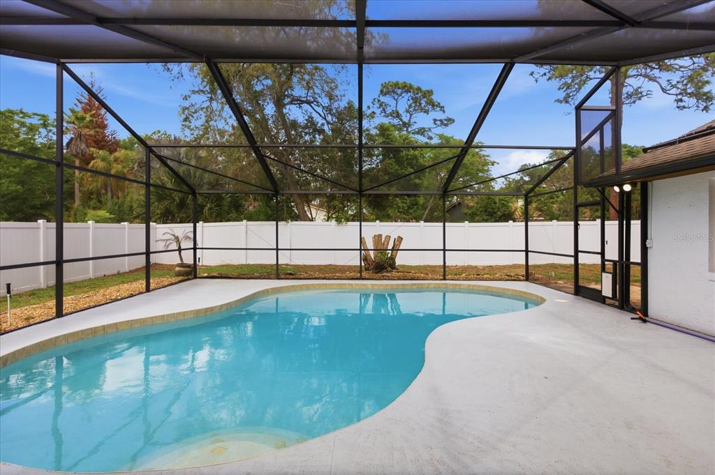 393 Wekiva Cove Road Longwood, FL 32779 - Photo 36 of 49 a view of a swimming pool with a porch