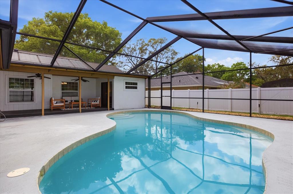 393 Wekiva Cove Road Longwood, FL 32779 - Photo 38 of 49 a view of a backyard with a swimming pool