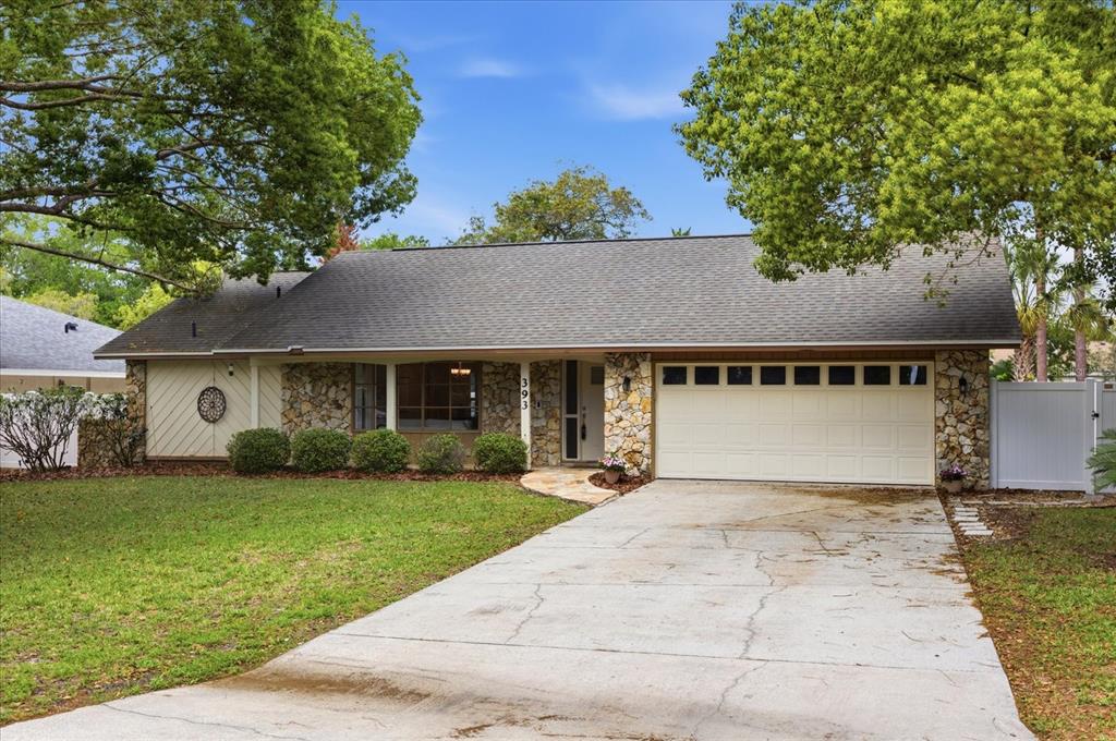 393 Wekiva Cove Road Longwood, FL 32779 - Photo 40 of 49 front view of a house with a yard