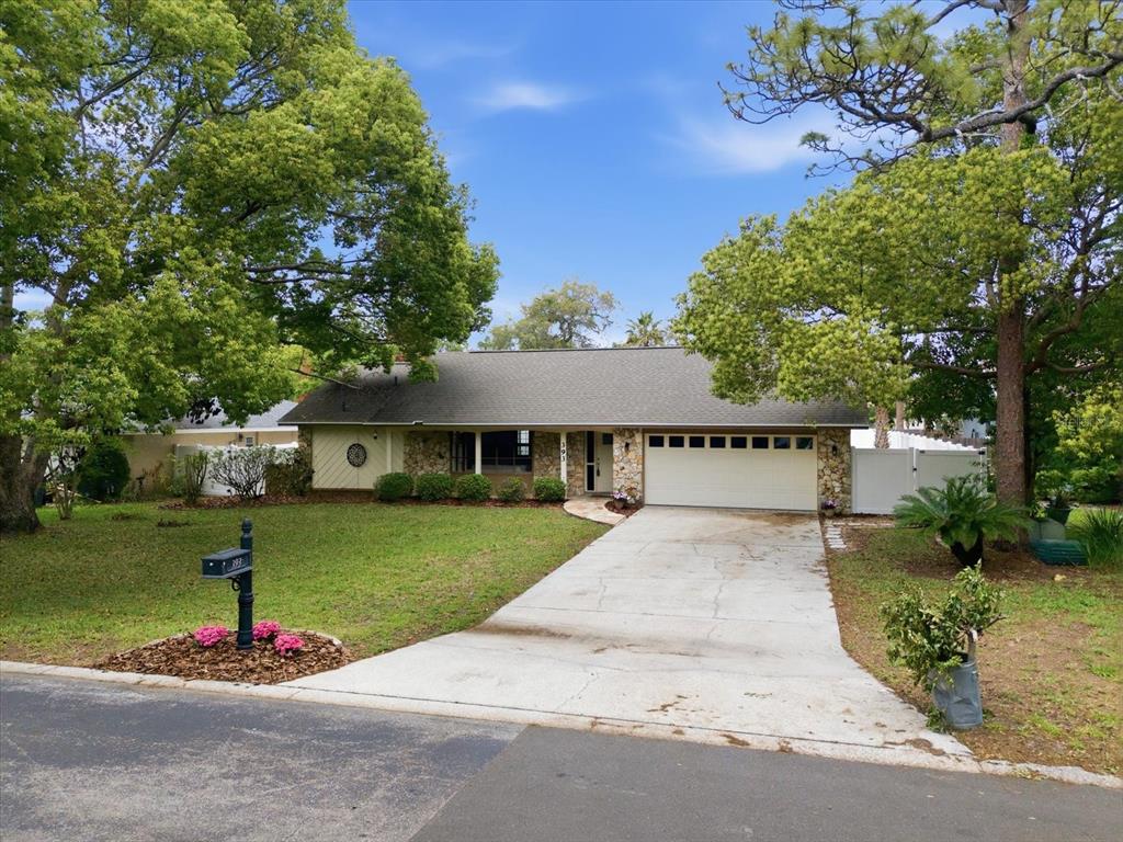393 Wekiva Cove Road Longwood, FL 32779 - Photo 43 of 49 a view of a house with garden