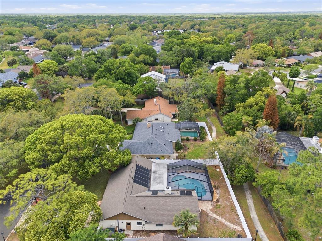 393 Wekiva Cove Road Longwood, FL 32779 - Photo 44 of 49 an aerial view of a house with a yard and lake view