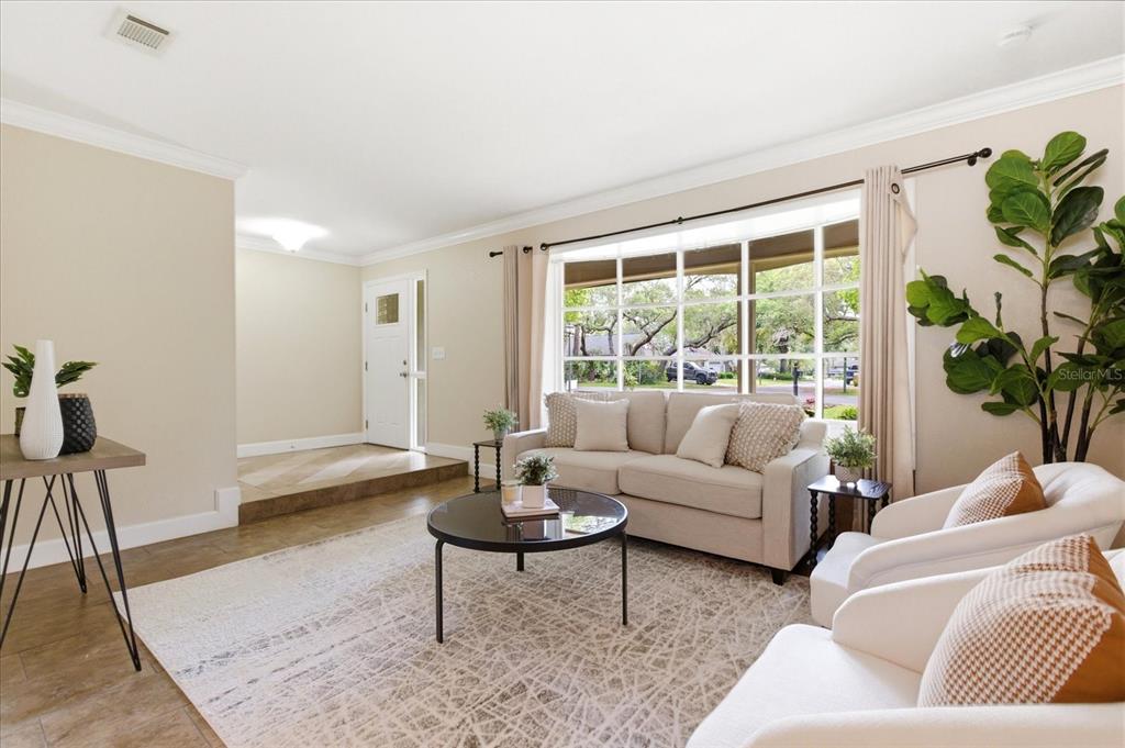 393 Wekiva Cove Road Longwood, FL 32779 - Photo 5 of 49 a living room with furniture and a large window