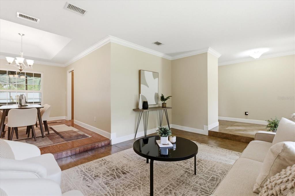 393 Wekiva Cove Road Longwood, FL 32779 - Photo 6 of 49 a living room with furniture and a wooden floor