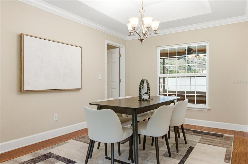 393 Wekiva Cove Road Longwood, FL 32779 - Photo 7 of 49 a view of a dining room with furniture and window