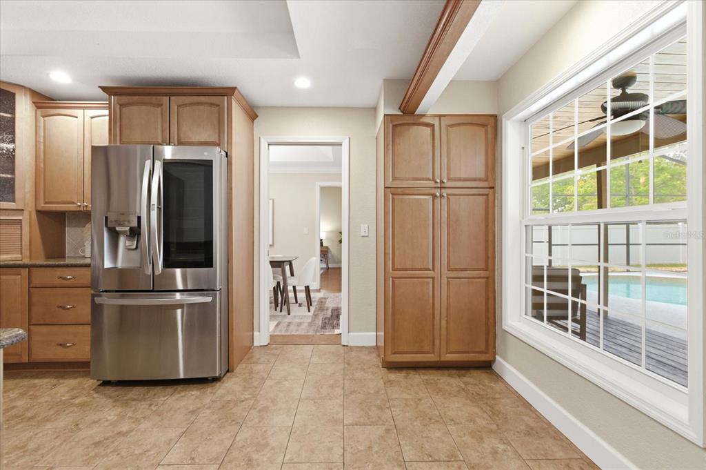 393 Wekiva Cove Road Longwood, FL 32779 - Photo 10 of 49 a kitchen with stainless steel appliances granite countertop a refrigerator and a sink