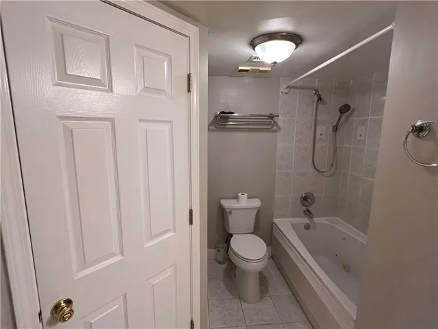 a bathroom with a toilet a sink and bathtub
