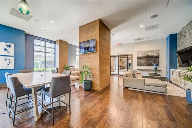 a dining room with furniture and wooden floor