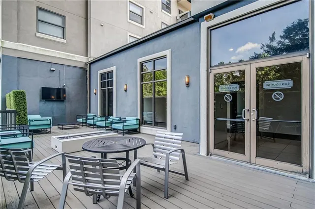 a outdoor living space with furniture and a fireplace