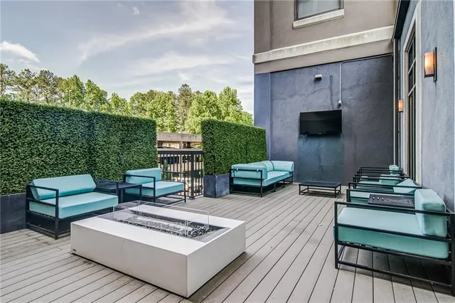 a swimming pool with outdoor seating and yard