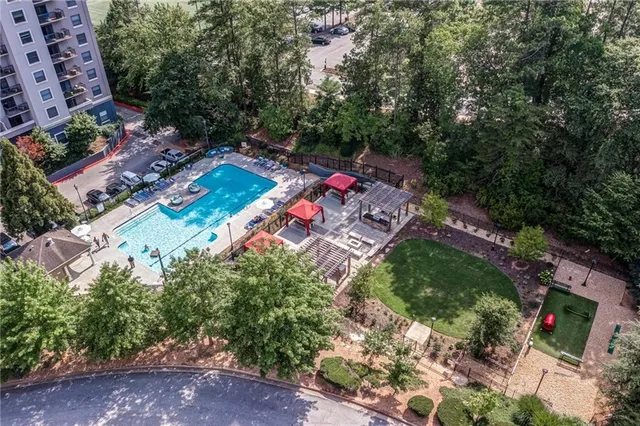 a view of a patio with table and chairs and wooden floor with a yard