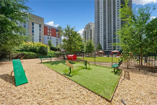 a view of a patio with a table and chairs