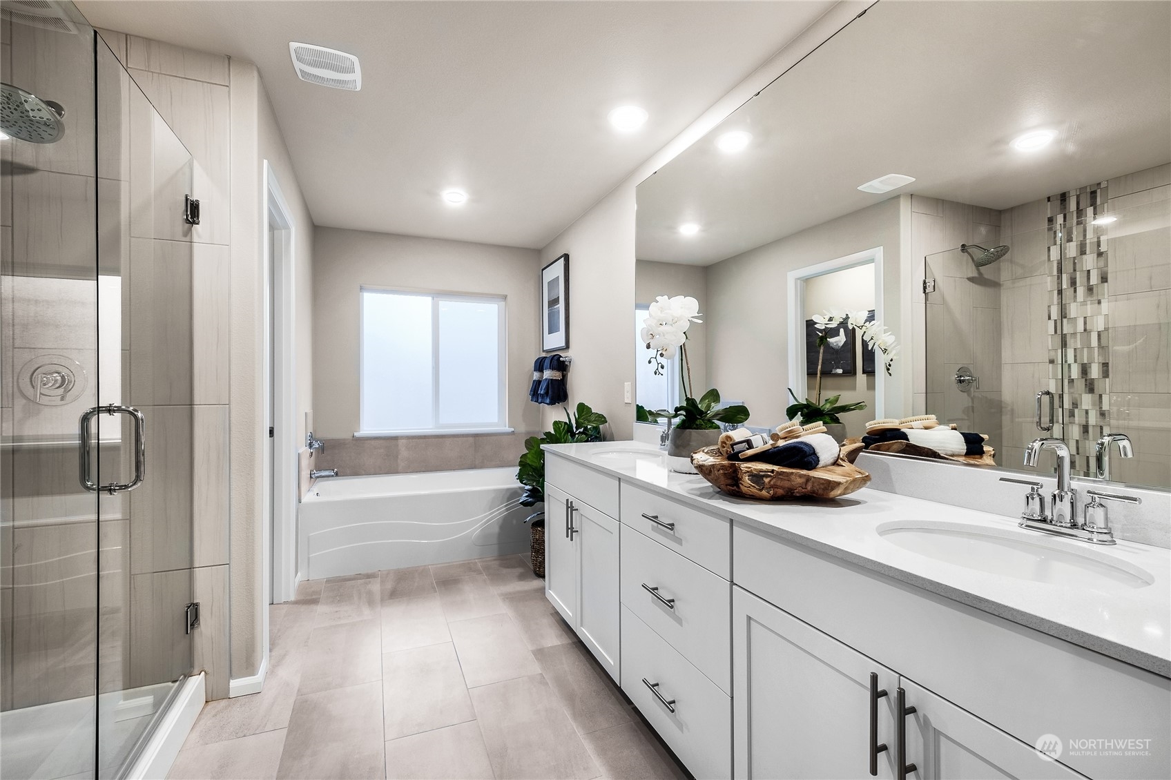 3932 233rd Street Southeast, Unit 83 Bothell, WA 98021 - Photo 15 of 18 a spacious bathroom with a double vanity sink mirror and shower