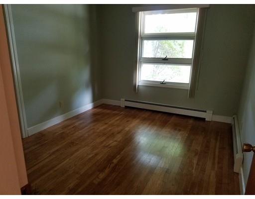 240 Alden Road Fairhaven, MA 02719 - Photo 11 of 19 a view of an empty room with wooden floor and a window