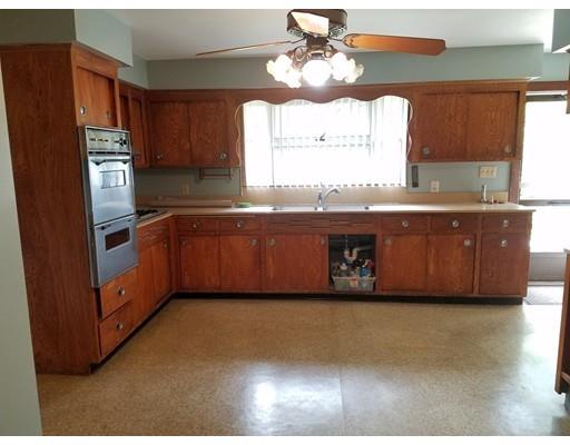 240 Alden Road Fairhaven, MA 02719 - Photo 5 of 19 a kitchen with stainless steel appliances granite countertop a stove a sink and a refrigerator