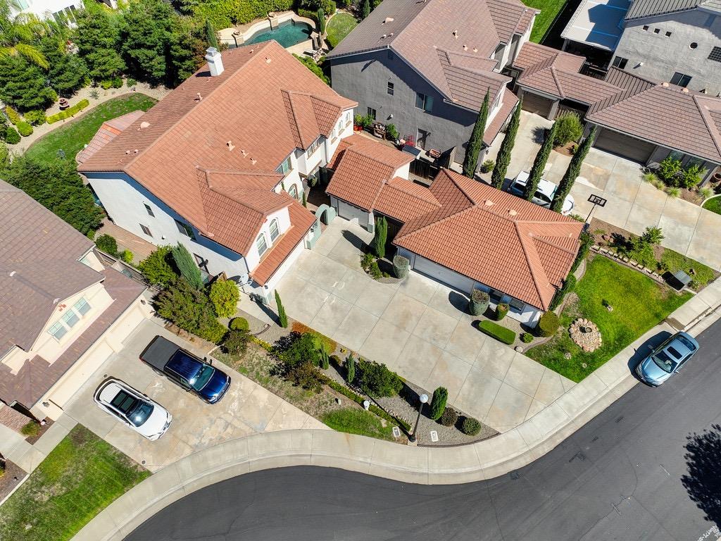 an aerial view of a house with a yard basket ball court