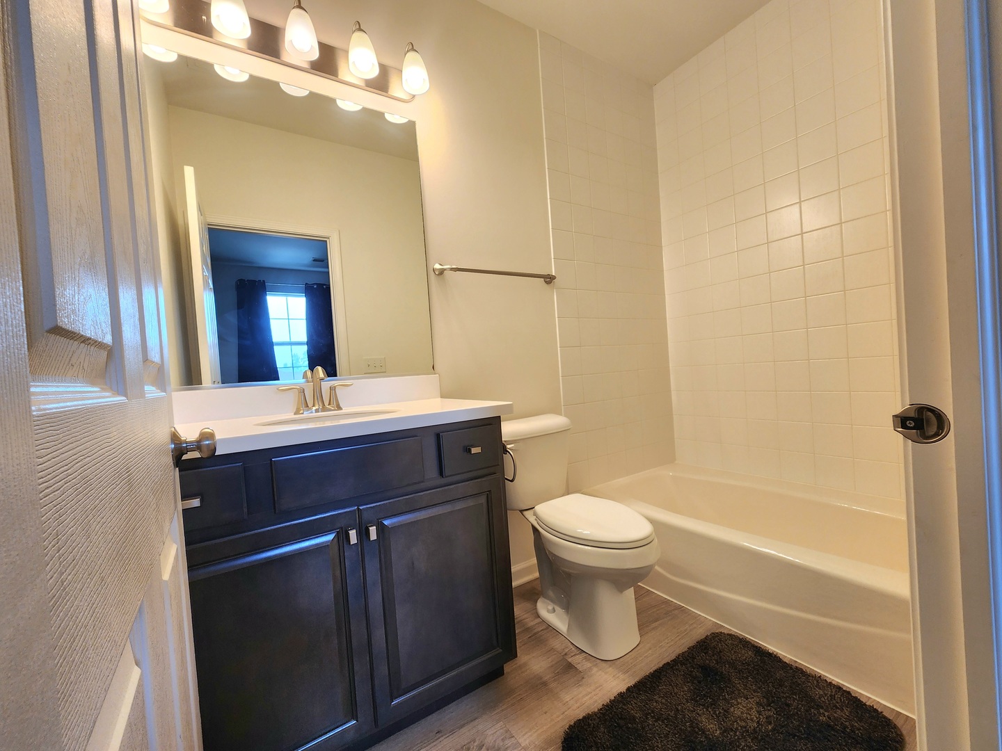 2003 Magenta Lane Algonquin, IL 60102 - Photo 13 of 29 a bathroom with a sink a toilet a mirror and bathtub