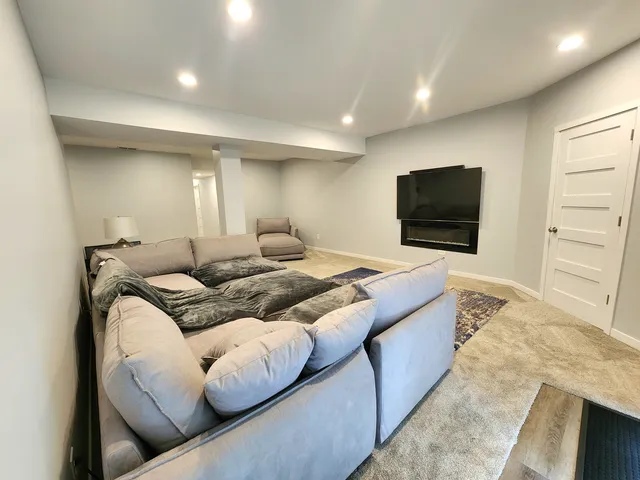 a bedroom with bed and a flat screen tv