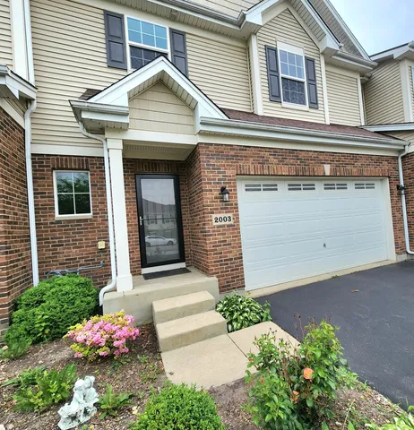 a front view of a house with an outdoor space