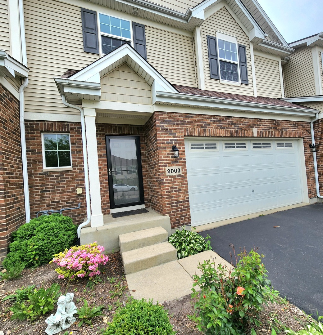2003 Magenta Lane Algonquin, IL 60102 - Photo 2 of 29 a front view of a house with an outdoor space