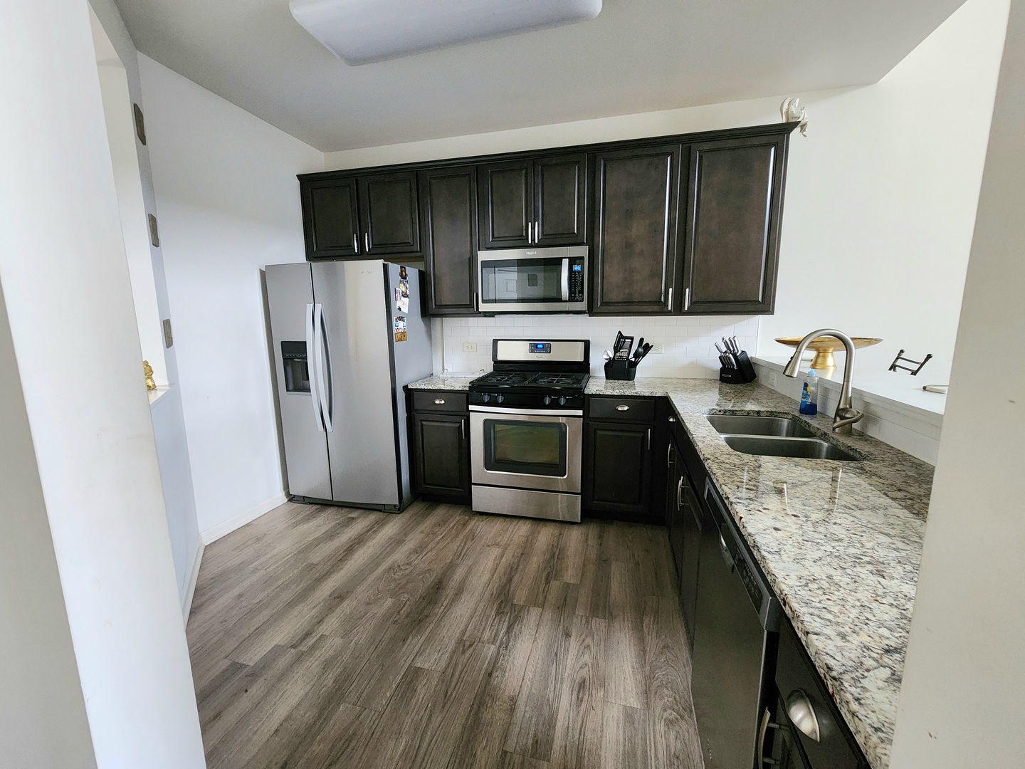 2003 Magenta Lane Algonquin, IL 60102 - Photo 5 of 29 a kitchen with a sink a microwave a refrigerator and cabinets