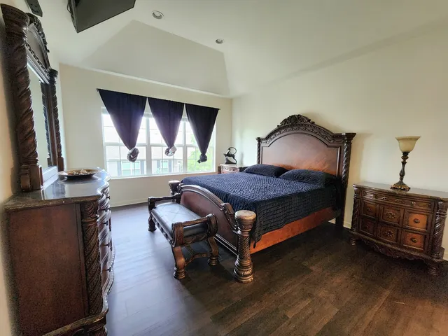 a bed room with furniture and a window