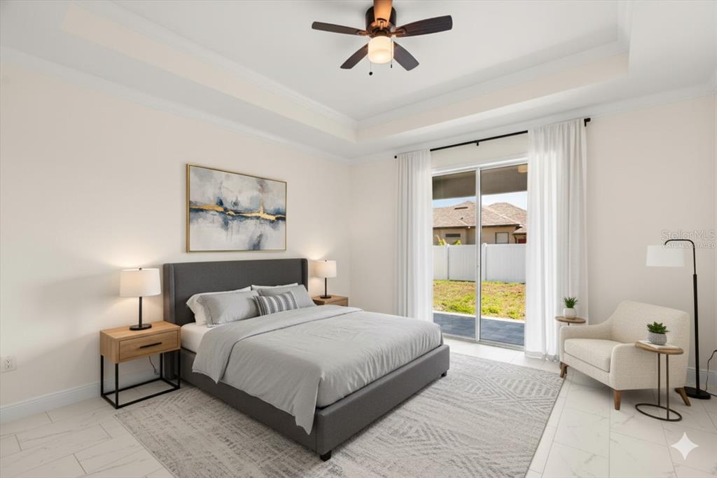 840 Oaks Shores Road Leesburg, FL 34748 - Photo 11 of 25 a bedroom with a bed and a window