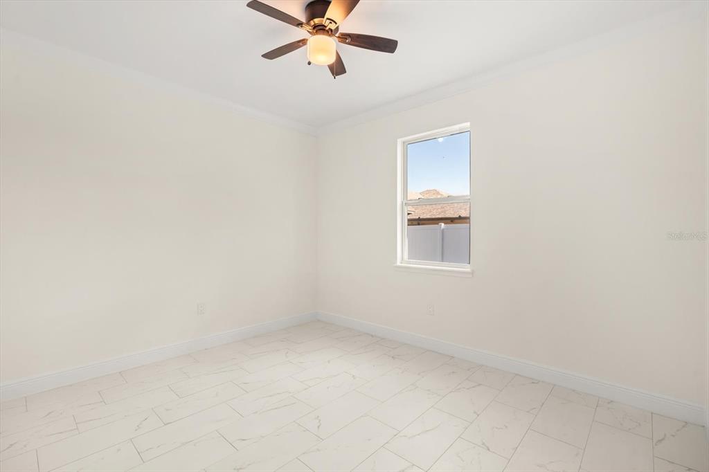 840 Oaks Shores Road Leesburg, FL 34748 - Photo 19 of 25 a view of an empty room with a window