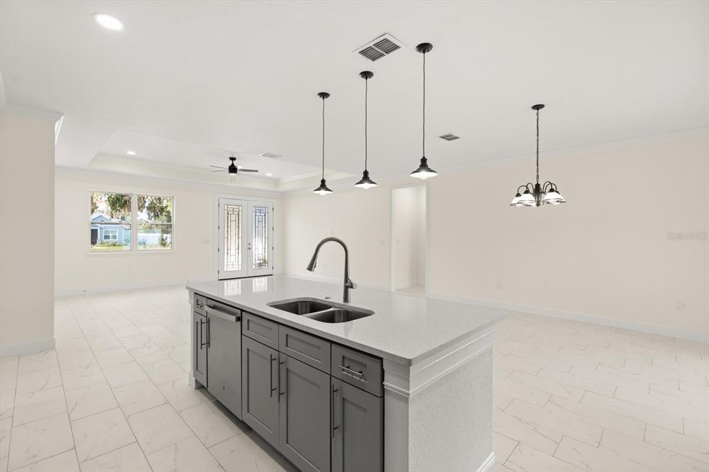 840 Oaks Shores Road Leesburg, FL 34748 - Photo 8 of 25 a kitchen with a sink and cabinets