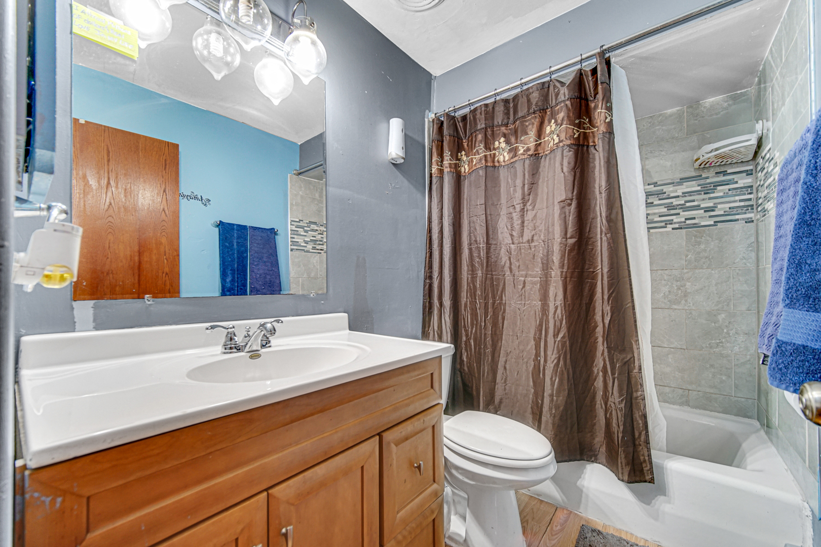 903 Elder Road, Unit 7 Homewood, IL 60430 - Photo 15 of 23 a bathroom with a sink a toilet and shower