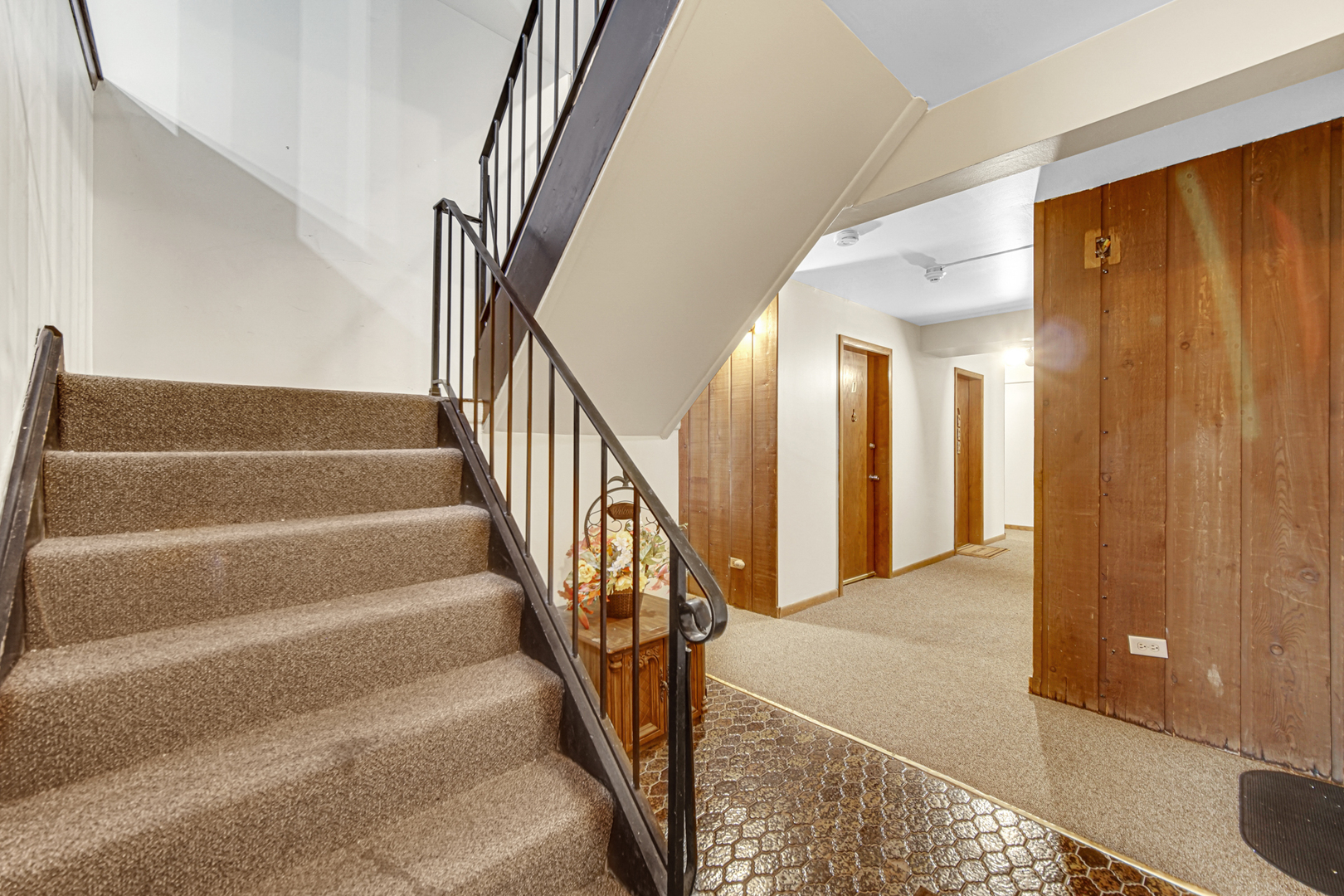 903 Elder Road, Unit 7 Homewood, IL 60430 - Photo 21 of 23 a view of staircase with lots of frames on wall and a large window