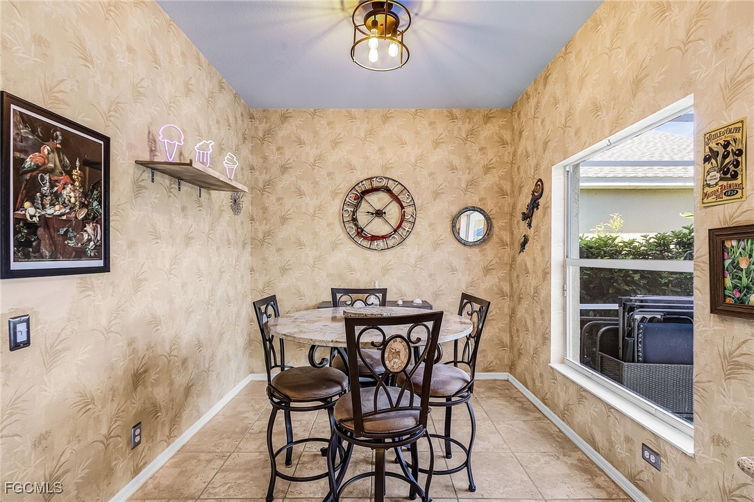 9021 Falcon Pointe Loop Fort Myers, FL 33912 - Photo 13 of 39 a view of a dining area with furniture and a table