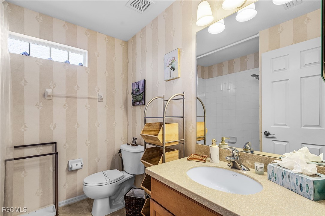 9021 Falcon Pointe Loop Fort Myers, FL 33912 - Photo 24 of 39 a bathroom with a sink toilet and shower