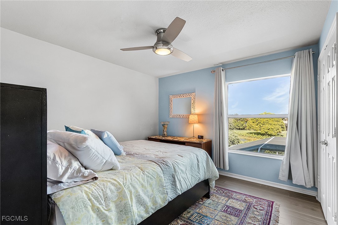 9021 Falcon Pointe Loop Fort Myers, FL 33912 - Photo 25 of 39 a bedroom with bed and a window