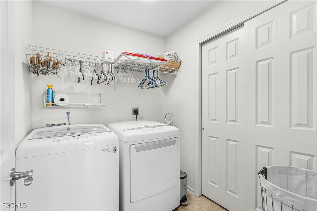 9021 Falcon Pointe Loop Fort Myers, FL 33912 - Photo 26 of 39 a utility room with dryer and washer