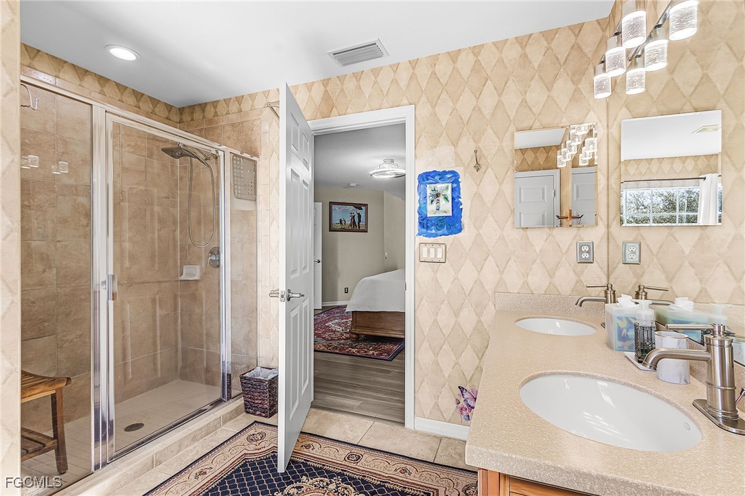 9021 Falcon Pointe Loop Fort Myers, FL 33912 - Photo 30 of 39 a bathroom with a sink and a mirror