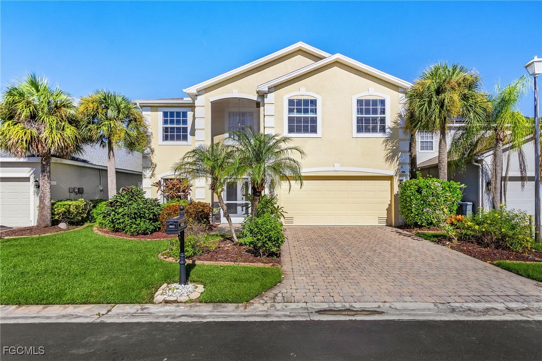 9021 Falcon Pointe Loop Fort Myers, FL 33912 - Photo 37 of 39 a front view of a house with a yard and garage