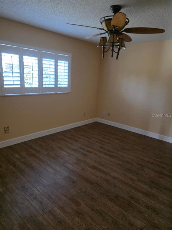9028 Southwest 91st Circle Ocala, FL 34481 - Photo 11 of 31 a view of wooden floor and windows in a room