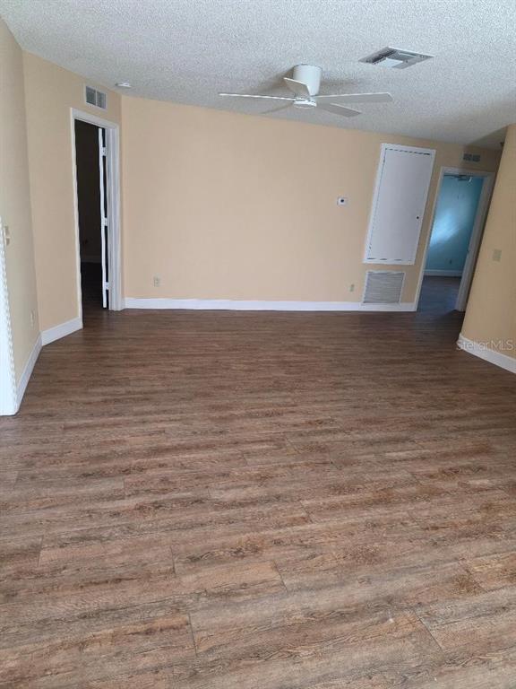 9028 Southwest 91st Circle Ocala, FL 34481 - Photo 5 of 31 wooden floor in an empty room