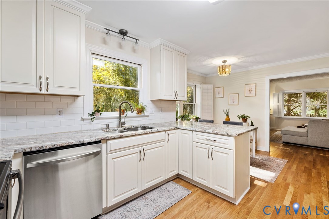 14701 Acorn Ridge Place Midlothian, VA 23112 - Photo 11 of 26 a kitchen with a sink window and cabinets