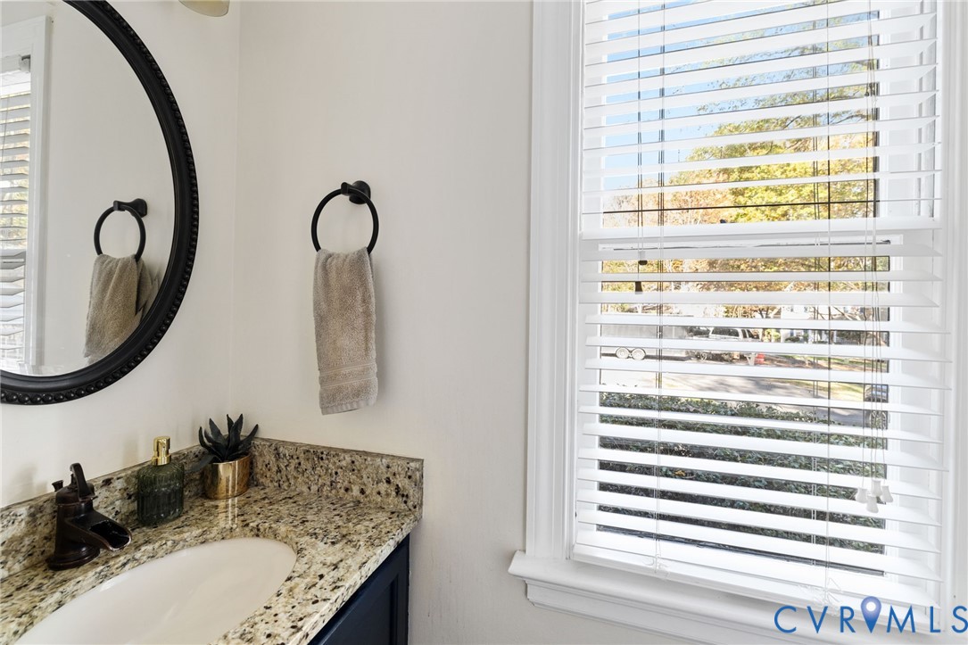 14701 Acorn Ridge Place Midlothian, VA 23112 - Photo 13 of 26 a bathroom with a granite countertop sink and a mirror
