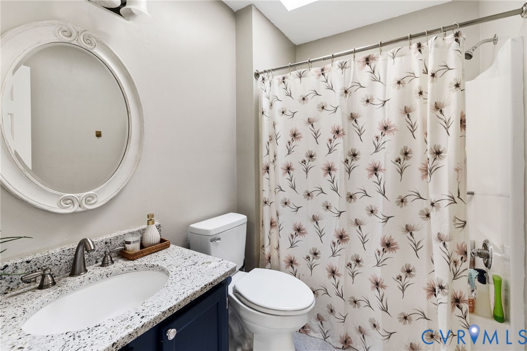 14701 Acorn Ridge Place Midlothian, VA 23112 - Photo 19 of 26 a bathroom with a granite countertop toilet sink and mirror